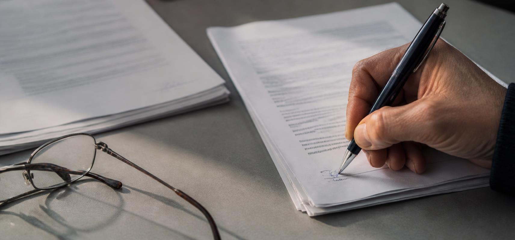 Close-up of an employment agreement signature block