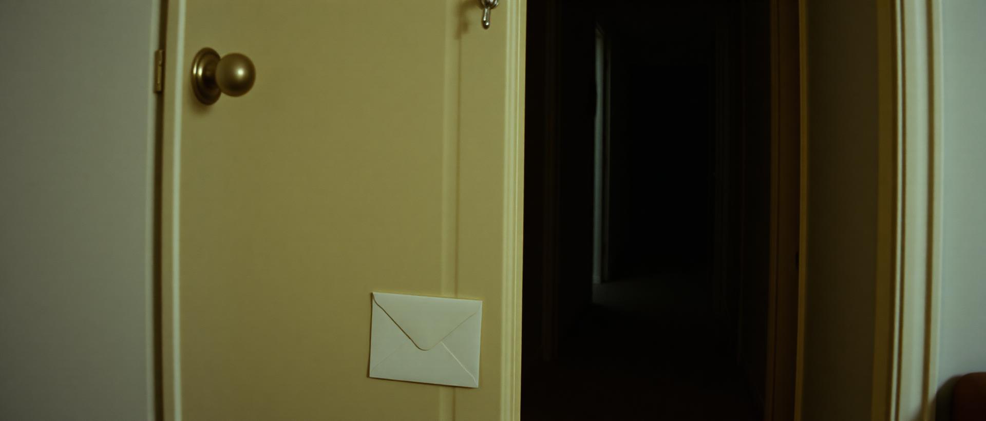 A formal notice taped to the door of a rented property