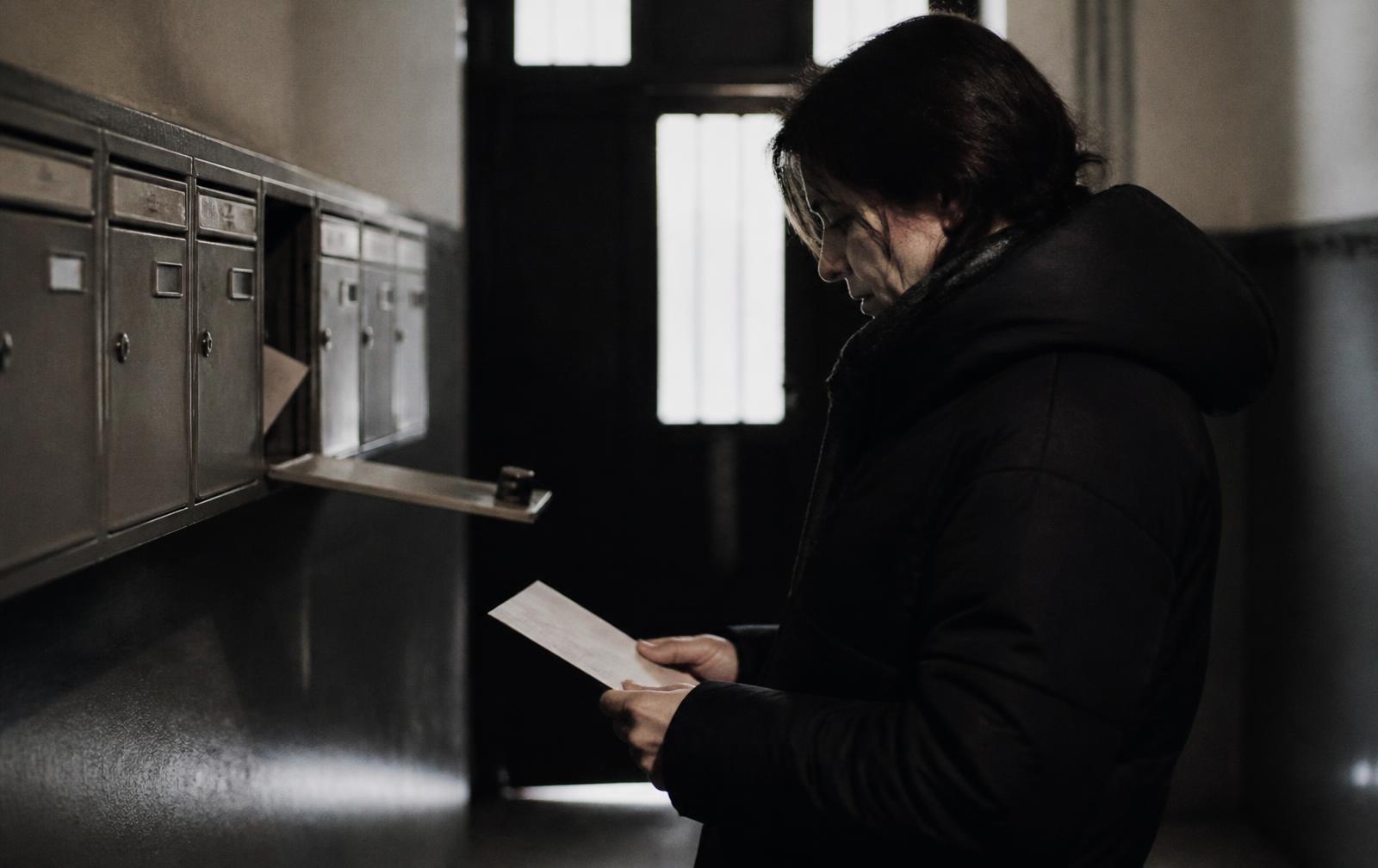 A property manager preparing notices at a desk